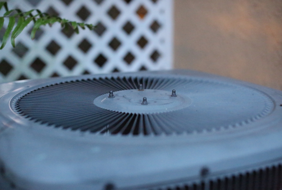 Close-up of an air conditioner showing dust and debris buildup, highlighting the importance of regular AC cleaning, how to clean AC unit, improve energy efficiency, prevent airflow blockages, and extend system life; relevant to Family Heating and Cooling’s HVAC maintenance, AC repair, and cooling services. Trust us to help with how to clean ac unit, how to clean air conditioner, clean air conditioner coils, clean AC condenser, how to clean AC evaporator coil, AC coil cleaning near me, air conditioner cleaning service, AC maintenance near me, HVAC cleaning services, clean outside AC unit, how to clean central air conditioner, air conditioning maintenance near me, HVAC maintenance near me, how to clean AC filter, clean home AC unit, best way to clean air conditioner, professional AC cleaning near me, Family Heating and Cooling AC services, residential AC cleaning, AC tune up near me, air conditioner service near me, clean clogged AC drain line, how to improve AC performance, AC not cooling needs cleaning, annual HVAC cleaning, seasonal air conditioner maintenance, how to clean HVAC system, AC cleaning tips, local HVAC cleaning experts.