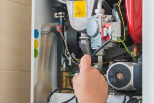Furnace repair service by Family Heating and Cooling – reliable heating technicians inspecting a furnace to determine repair costs, average furnace repair price, furnace maintenance, heating system service, and affordable furnace repair in New Bedford, Fall River, Taunton, Dartmouth, Somerset, and Fairhaven. Call now for help with furnace repair cost, average furnace repair price, how much does it cost to fix a furnace, furnace repair near me, heating repair near me, HVAC repair cost, furnace service near me, furnace tune up cost, emergency furnace repair near me, affordable furnace repair, furnace replacement cost, heater repair cost, furnace installation near me, gas furnace repair near me, oil furnace repair cost, heating system repair near me, central heating repair cost, furnace blower motor replacement cost, furnace ignitor replacement cost, furnace heat exchanger repair cost, furnace maintenance near me, furnace inspection cost, heating and cooling repair near me, furnace parts replacement cost, professional furnace repair near me, furnace troubleshooting and repair cost.