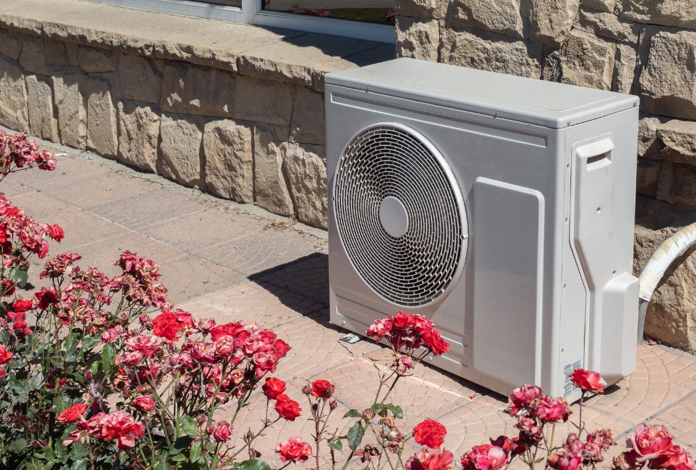 A residential heat pump unit being serviced by Family Heating and Cooling technicians, illustrating common heat pump repair, maintenance, and replacement issues for homeowners wondering are heat pumps expensive to fix. Contact us today for help with are heat pumps expensive to repair, heat pump repair cost, heat pump service near me, heat pump maintenance, heat pump replacement cost, affordable heat pump repair, heat pump troubleshooting, emergency heat pump repair, heat pump not heating, heat pump not cooling, heat pump repair services, heat pump installation, residential heat pump repair, commercial heat pump service, heat pump diagnostics, heat pump efficiency issues, heat pump problems near me, heat pump repair technicians, best heat pump repair near me, local heat pump service, Family Heating and Cooling heat pump repair, Family Heating and Cooling HVAC services, professional heat pump maintenance, heat pump repair and replacement, energy-efficient heat pump repair, reliable heat pump service near me, licensed heat pump technicians, heat pump system repair, heat pump inspection and tune-up, fix heat pump issues near me.