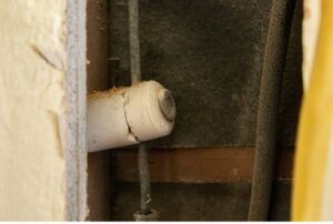 Knob and tube wiring in an older home, highlighting electrical safety concerns, home rewiring options, and professional inspections by Family Heating, Cooling and Electric to ensure code compliance and safe electrical upgrades. Reach out to us today for help with is knob and tube wiring still legal, knob and tube wiring inspection, knob and tube wiring replacement, knob and tube wiring repair, knob and tube wiring safety, old house electrical wiring, knob and tube wiring code, home rewiring services, electrical rewiring, knob and tube wiring upgrade, knob and tube wiring removal, outdated wiring solutions, electrical system inspection, home electrical safety, rewiring an older home, house rewiring cost, electrical upgrades near me, knob and tube wiring services near me, professional electricians near me, licensed electrical contractor, electrical safety inspection, knob and tube wiring check, house wiring replacement, home wiring repair, electrical code compliance, home electrical upgrades, safe electrical wiring solutions.