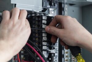 Electrical panel installation and upgrade by licensed electricians, showing a modern breaker box for safe home wiring, professional electrical panel replacement, and solutions to determine how much a full electrical panel costs by Family Heating, Cooling, Electric and Plumbing. Reach out to us today for help with how much does a full electrical panel cost, electrical panel replacement cost, breaker panel upgrade, main service panel installation, residential electrical panel cost, commercial electrical panel replacement, electric panel repair, electrical panel upgrade near me, licensed electrician for panel installation, panel breaker replacement, electric service upgrade, electrical panel installation cost, home electrical panel inspection, panel wiring repair, breaker box replacement, full electrical panel service near me, electric panel troubleshooting, 24/7 electrical repair services, professional electricians near me, safe electrical panel installation, panel upgrade estimate, electrical service panel installation, panel maintenance and repair.