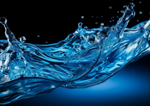 Dynamic splash of clear blue water against a dark background.