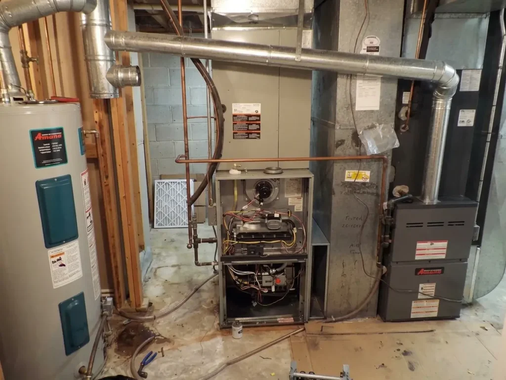 An open basement furnace unit exposed during maintenance when the furnace stops working.